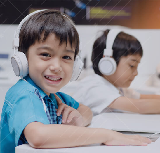 Elementary School Coding Program, Boy in Class Smile